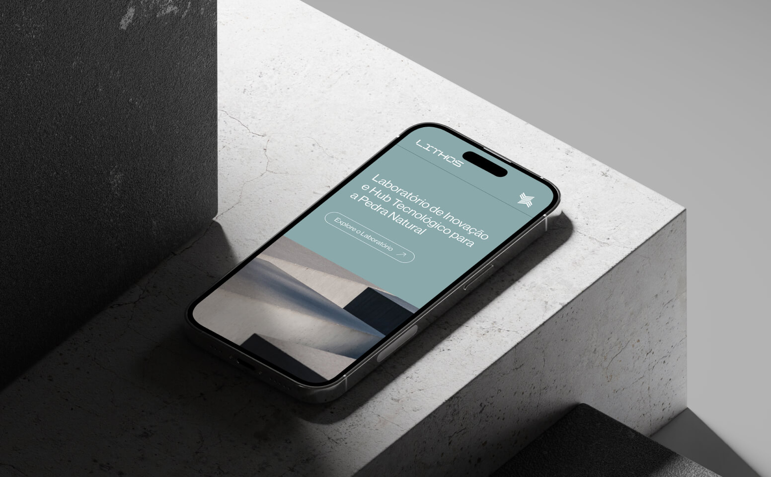 Smartphone with LITHOS website under concrete blocks